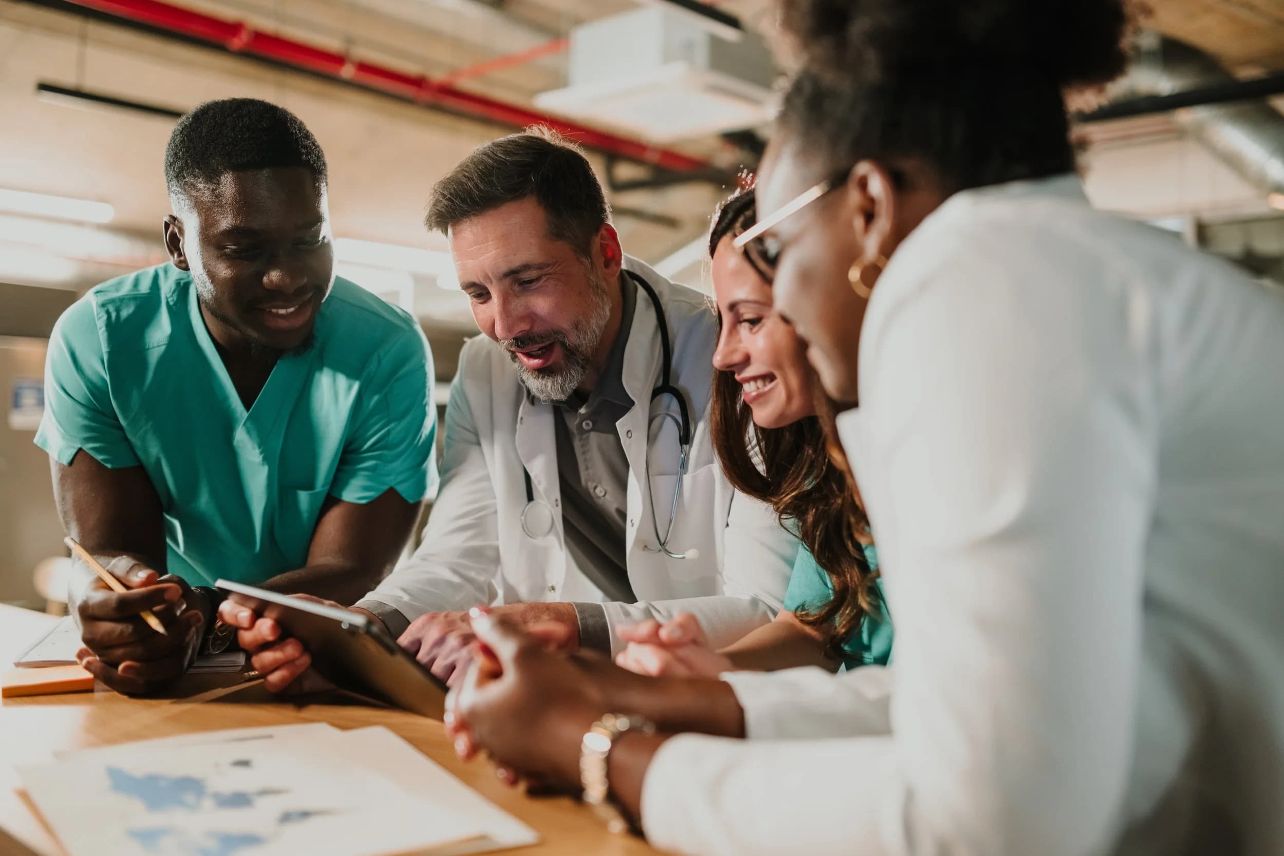 Hospital team reviewing data on a screen